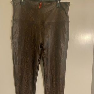 Excellent condition. Snake skin print black and brown